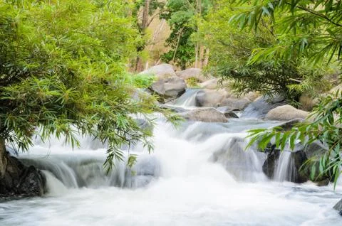 Waterfall on the mountain. Stock Photos