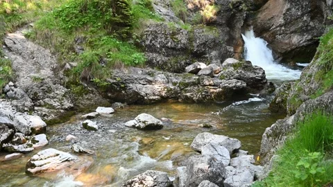 A waterfall from a mountain river and rocks Video stock 219351066
