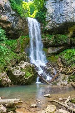 Waterfall on a mountain river, the beginning of the spring season , nature wa Stock Photos