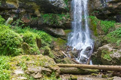 Waterfall on a mountain river, the beginning of the spring season , nature wa Stock Photos