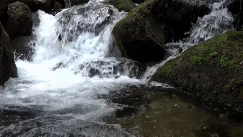 Waterfall on the mountain river, bouncing over boulders gray Stock Footage 96711568