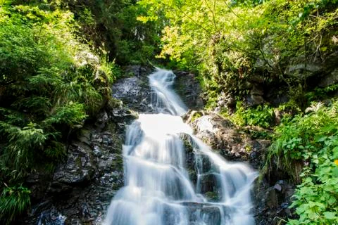 Waterfall on mountain river Stock Photos