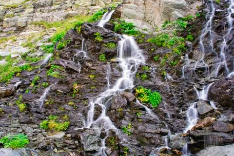 Waterfall on mountain river Stock Photos