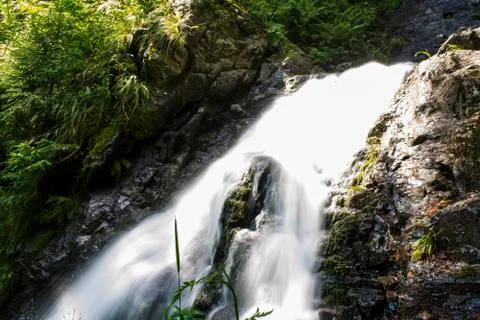 Waterfall on mountain river Stock Photos