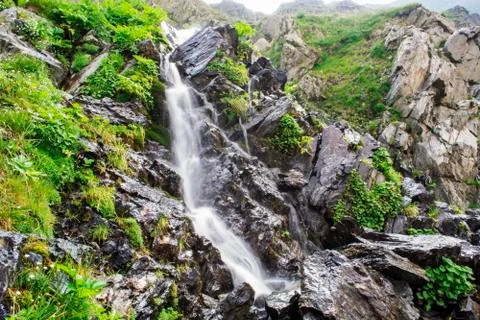 Waterfall on mountain river Stock Photos