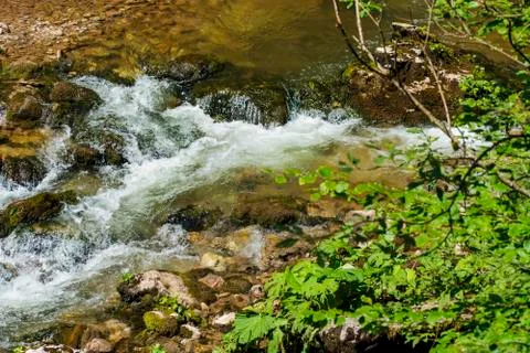 Waterfall on mountain river Stock Photos