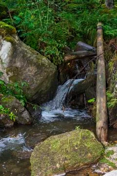 Waterfall on mountain river Stock Photos