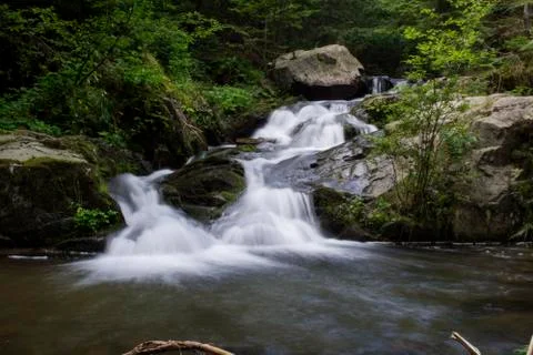 Waterfall on mountain river Stock Photos