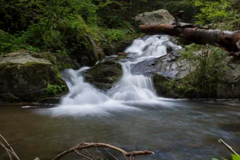 Waterfall on mountain river Stock Photos