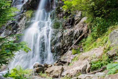 Waterfall on mountain river Stock Photos