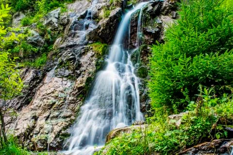 Waterfall on mountain river Stock Photos