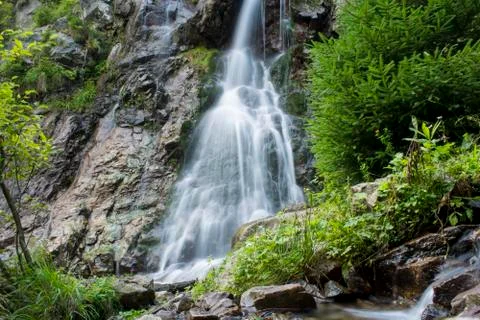 Waterfall on mountain river Stock Photos