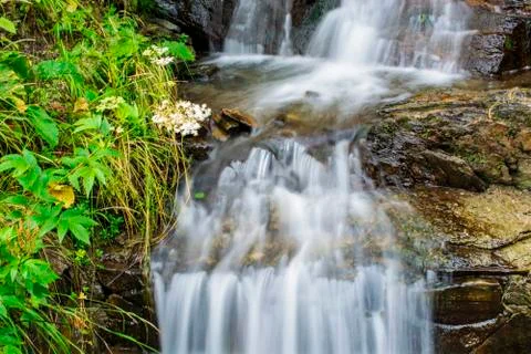 Waterfall on mountain river Stock Photos