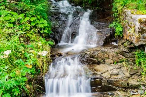 Waterfall on mountain river Stock Photos