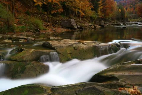 Waterfall on mountain river Stock Photos
