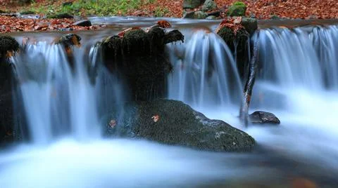 Waterfall on mountain river Stock Photos