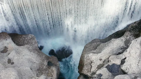 Waterfall on mountain river surrounded by rock. Water falling in big cascade Stock Footage 167540048