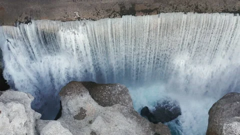 Waterfall on mountain river surrounded by rock. Water falling in big cascade Stock Footage 167547483