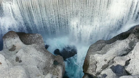 Waterfall on mountain river surrounded by rock. Water falling in big cascade Stock Footage 167560281