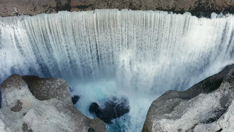 Waterfall on mountain river surrounded by rock. Water falling in big cascade Stock Footage 167564094