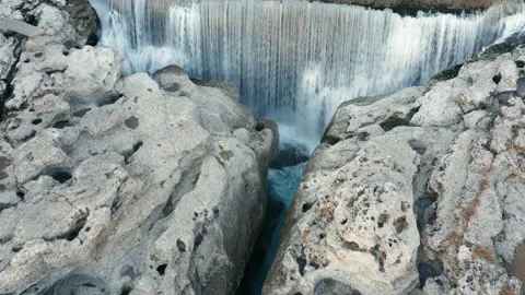 Waterfall on mountain river surrounded by rock. Water falling in big cascade Stock Footage 167572316
