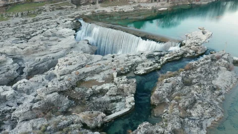 Waterfall on mountain river surrounded by rock. Water falling in big cascade Stock-Footage 167574027
