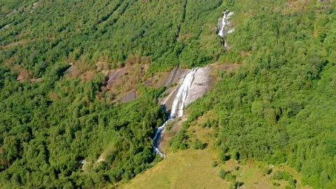 Waterfall in the mountain with trees Stock Footage 167404527