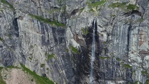 A waterfall in the mountain. View from a drone. Mountains and water Stock Footage 295069454