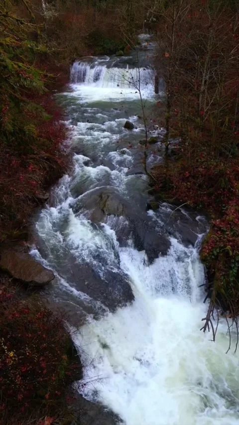 Waterfall in the mountains across rocks Stock Footage 274110664
