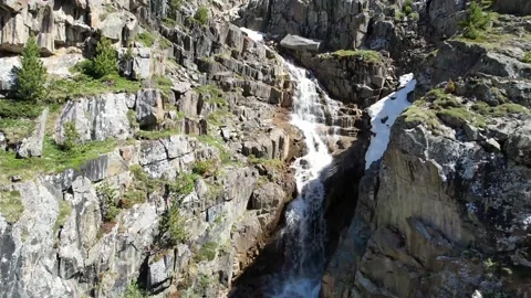 Waterfall in mountains captured by drone Stock Footage 212196193
