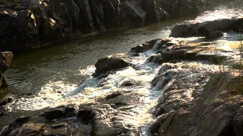 Waterfall in the mountains at evening Stock Footage 144088614