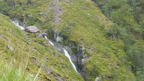 A waterfall in the mountains. Stock Footage 112681477