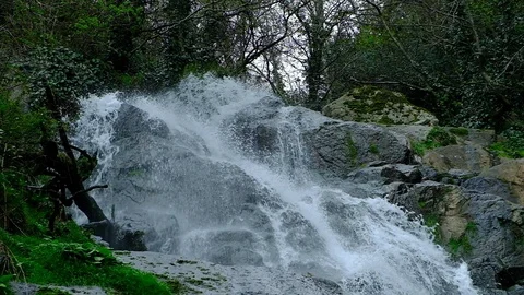 Waterfall in the mountains Stock Footage 128812679
