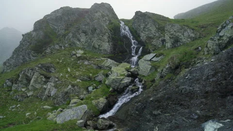Waterfall in the mountains Stock Footage 138484256