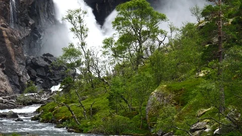Waterfall in mountains of Norway in rainy weather. Stock Footage