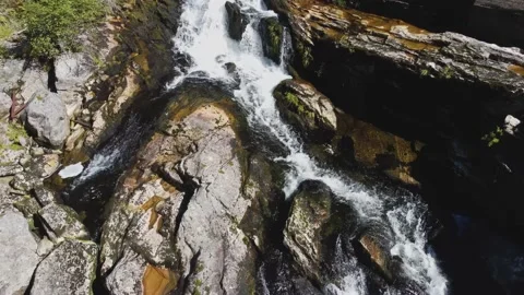 Waterfall in the mountains of Norway. Strong flow of water in a mountain river. Stock Footage 204733653