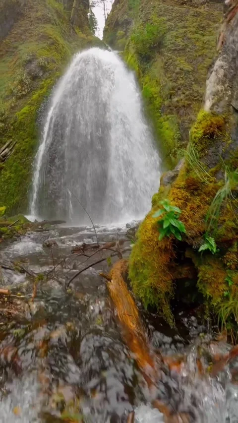 Waterfall in the mountains over rocks Stock Footage 274043748