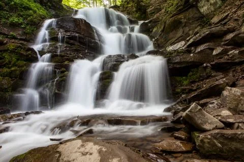 Waterfall in mountains Stock Photos