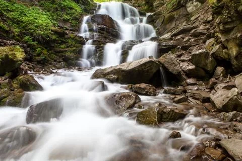 Waterfall in mountains Stock Photos
