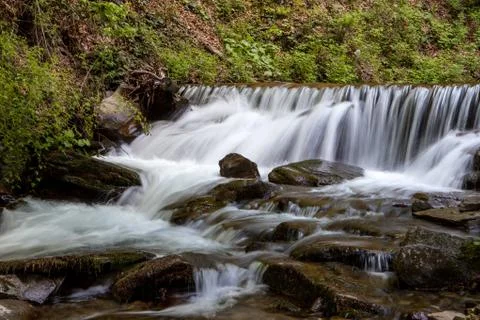 Waterfall in mountains Stock Photos