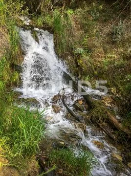 Waterfall in the Mountains Stock Photos