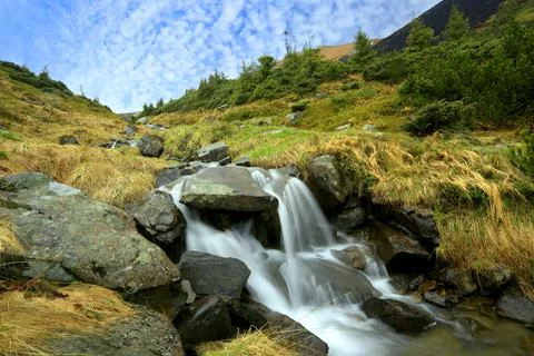 Waterfall in mountains Stock Photos