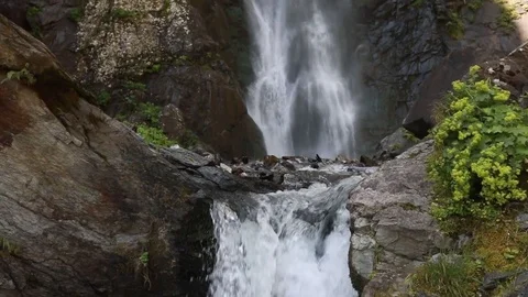 Waterfall in the mountains. Slow motion. Stock Footage 79890892
