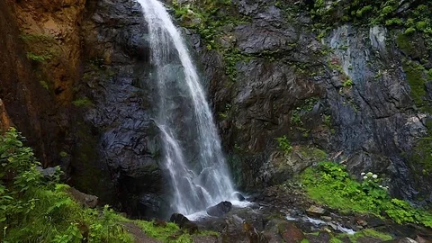 Waterfall in the mountains. Slow motion. Stock Footage 79890979