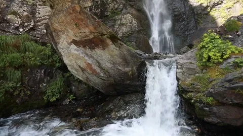 Waterfall in the mountains. Slow motion. Stock Footage 79890981