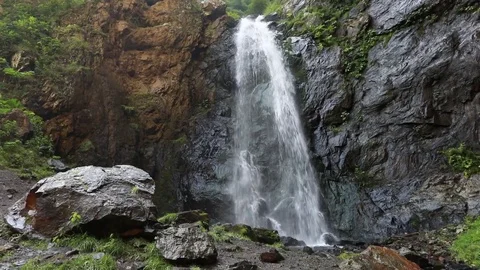 Waterfall in the mountains. Slow motion. Stock Footage 79890997