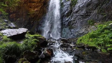 Waterfall in the mountains. Slow motion. Stock Footage 79891017
