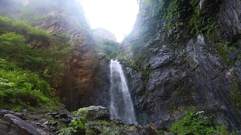 Waterfall in the mountains. Slow motion. Video stock 79891060