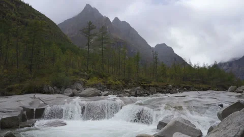 Waterfall in mountains in slow motion, high speed reel. Slow motion dolly shot. Stock Footage 96107103
