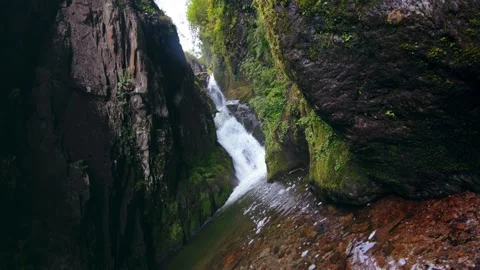 Waterfall in mountains. Steadicam shot. Stock Footage 273965597